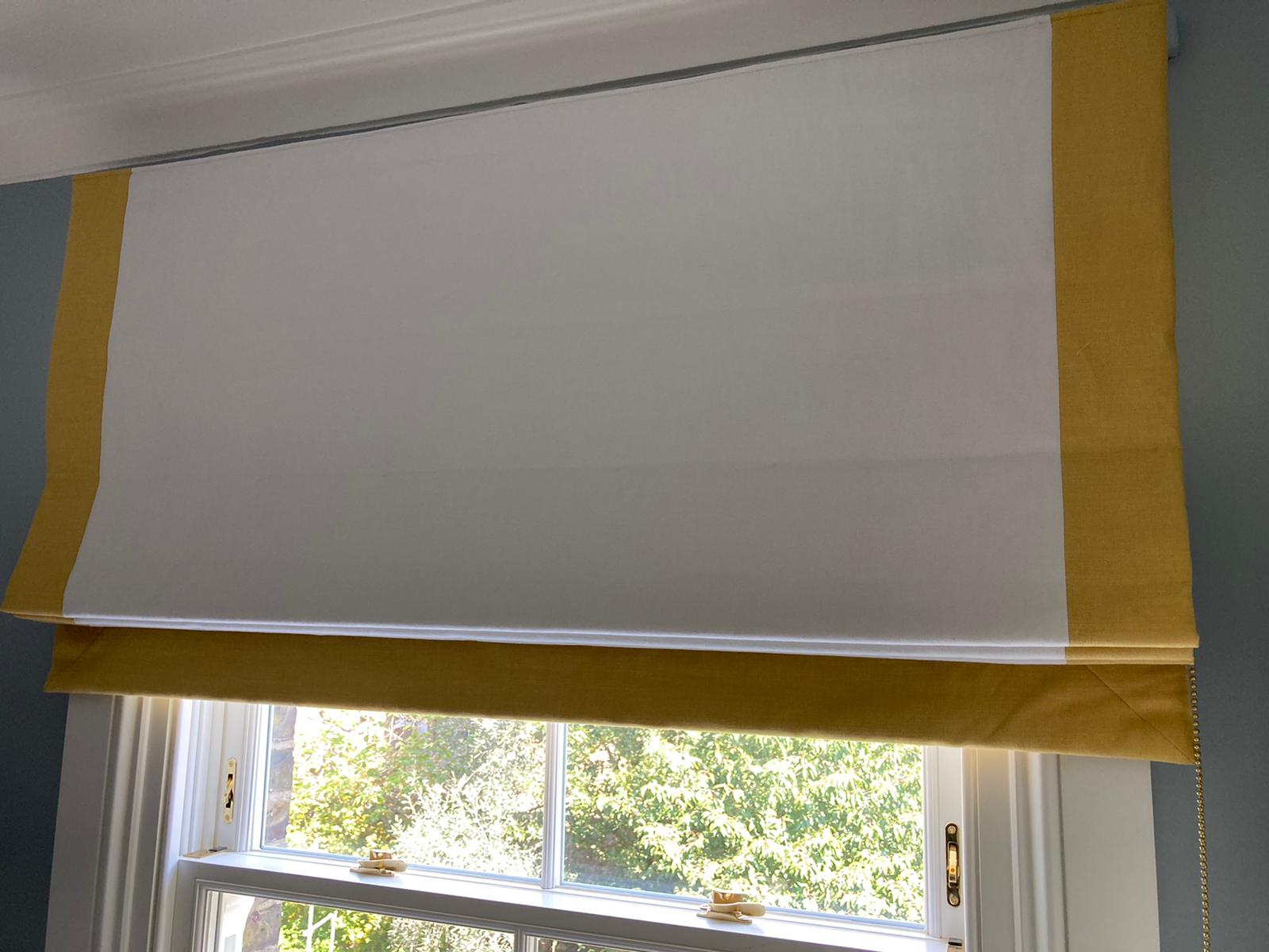 Bespoke Roman blind with a decorative contrast border